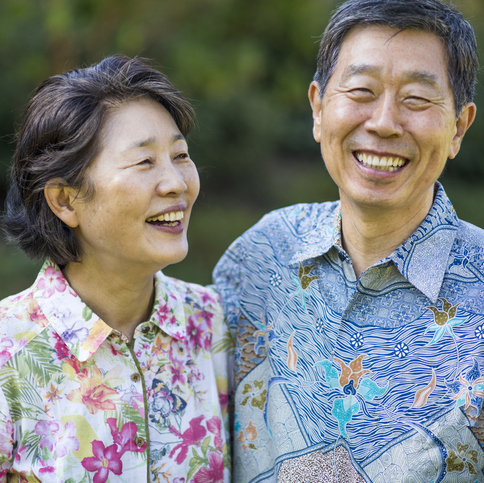 A beautiful Asian senior couple smiling and enjoying life together